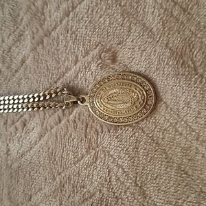 A gorgeous sterling silver Mary, mother of Jesus oval medallion necklace..